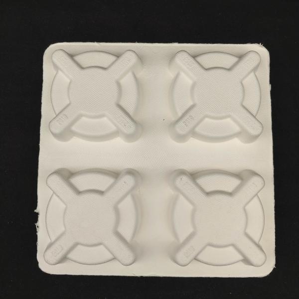 Made in China. The pulp-molded anti-shake base for takeaway coffee is environmentally friendly and biodegradable, and complies with the plastic ban.