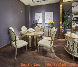 Quality Luxury dining room furniture circle table on golden leaf painting with Stainless steel legs used by Beech wood chairs wholesale
