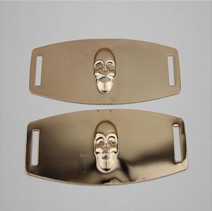 China Eco-friendly plating iron sheets gold color embossed skull logo shoe metal buckles for shoelace on sale