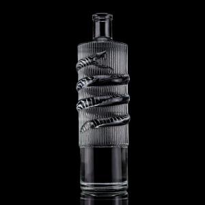 China Customized Logo Clear 750ml Bar Top Emossed Snake Drawing Glass Bottle for Vodka Cylinder on sale